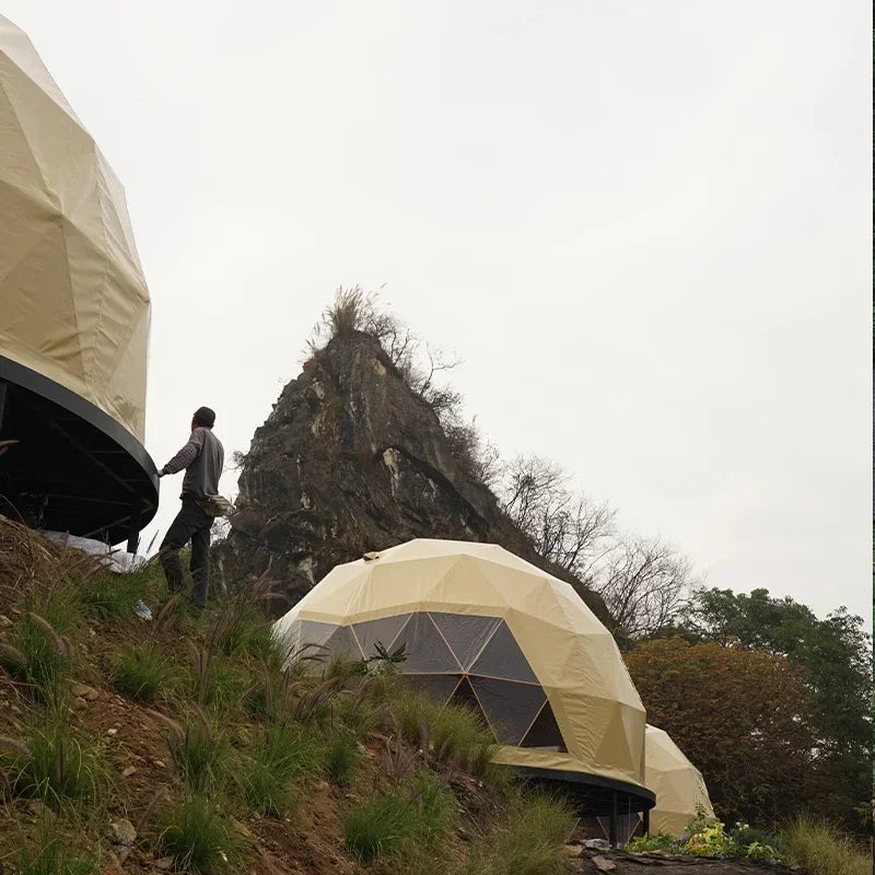 A luxury dome tent with a private bathroom and kitchenette, ideal for a hotel-style outdoor stay