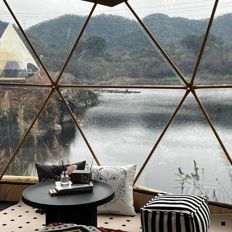 A luxury dome tent with a private bathroom and kitchenette, ideal for a hotel-style outdoor stay