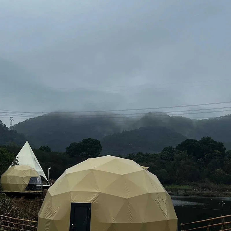 A luxury dome tent with a private bathroom and kitchenette, ideal for a hotel-style outdoor stay
